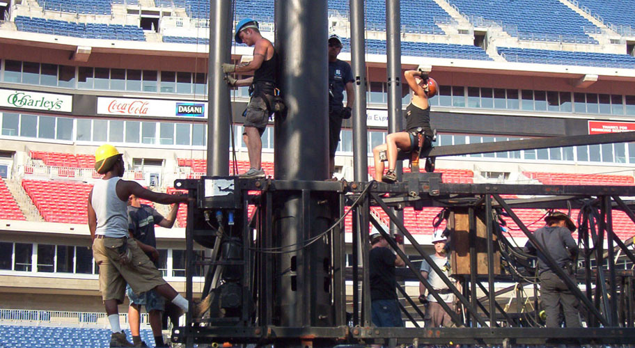 Stagehand crew rigging truss at CMA Awards stadium Nashville TN