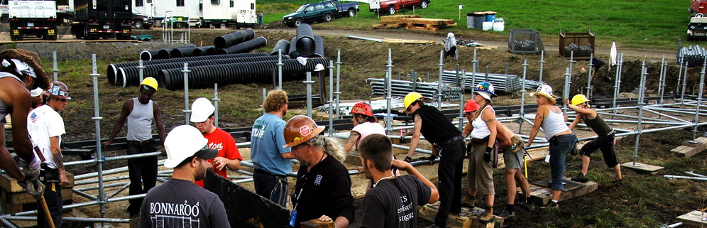Scaffolding crew in hard hats building festival infrastructure site operations